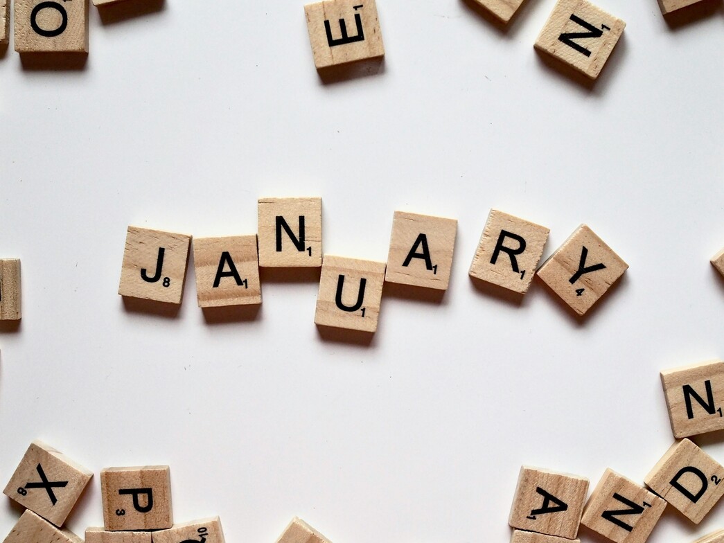 January spelled out in scrabble blocks on a white table